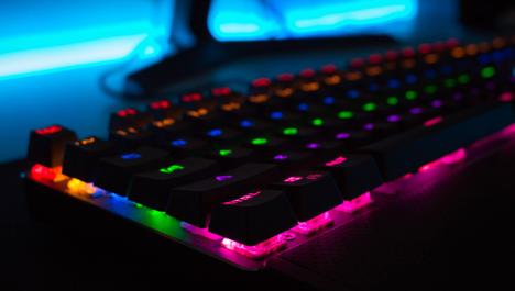 Black keyboard with colour LEDs. Photo by Mateo Vrbnjak on Unsplash.