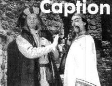 A caption competition image featuring Ah Wok and Julius Scaramonger in The Quest, the Official Newsletter of the Knightmare Adventurers' Club. Volume 2, Issue 1.