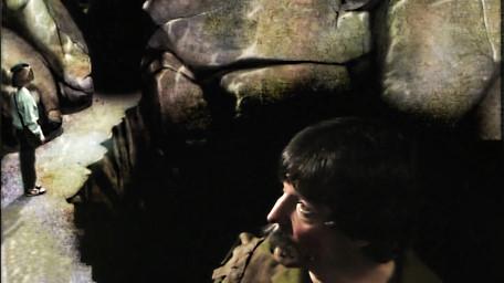 The Giant's Cave, based on a handpainted scene by David Rowe, as shown on Series 1 of Knightmare (1987).