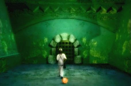 Knightmare Series 8 Team 3. Nathan walks away from a glowing amber globe towards a door.