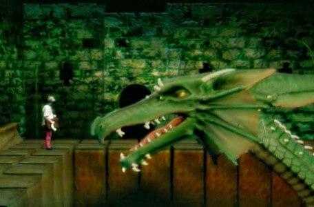Knightmare Series 8 Team 5. Rebecca stands on a perimeter ledge in front of Smirkenorff the Dragon.